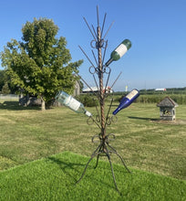 Wrought Iron Twisted Bottle Tree with a four-legged stand