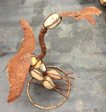 ROCK HEREIN W FISH IN MOUTH